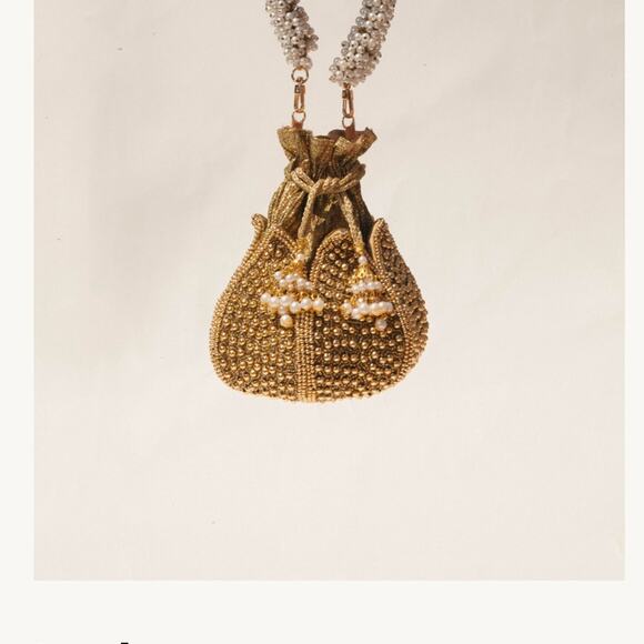 Ramla Leyla Embroided Lotus gold pearl Clutch
100% handmade by skilled artisans. - Picture 2 of 5